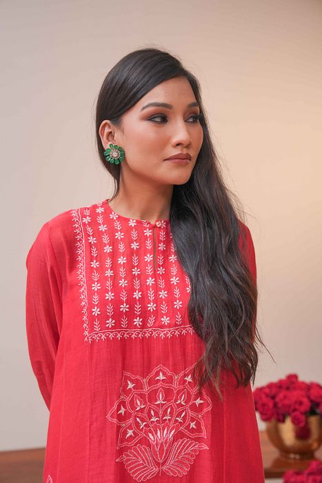 A model showcasing Red Chikankari Kurta Set by Myra By Anju Narian from Myra By Anju Narian's collection A model showcasing Red Chikankari Kurta Set by Myra By Anju Narian from Myra By Anju Narian's collection
