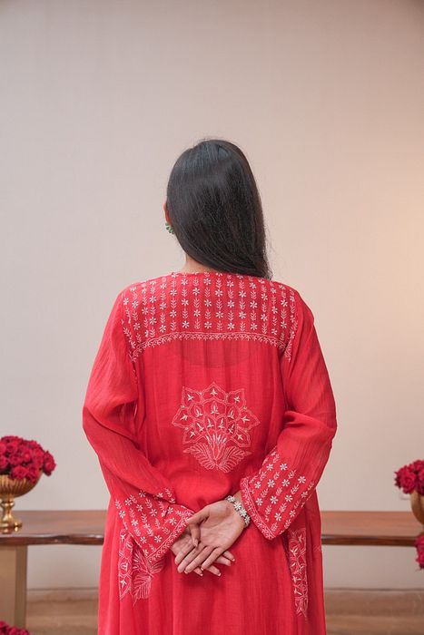 A model showcasing Red Chikankari Kurta Set by Myra By Anju Narian from Myra By Anju Narian's collection A model showcasing Red Chikankari Kurta Set by Myra By Anju Narian from Myra By Anju Narian's collection