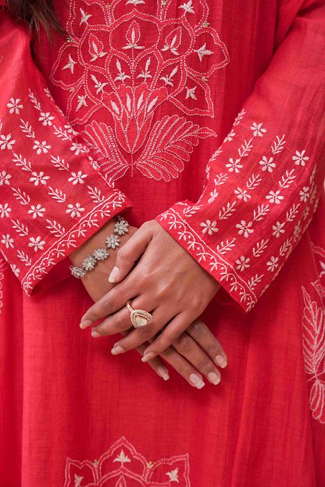 A model showcasing Red Chikankari Kurta Set by Myra By Anju Narian from Myra By Anju Narian's collection A model showcasing Red Chikankari Kurta Set by Myra By Anju Narian from Myra By Anju Narian's collection