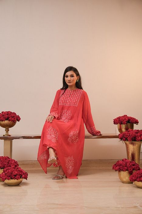 A model showcasing Red Chikankari Kurta Set by Myra By Anju Narian from Myra By Anju Narian's collection A model showcasing Red Chikankari Kurta Set by Myra By Anju Narian from Myra By Anju Narian's collection