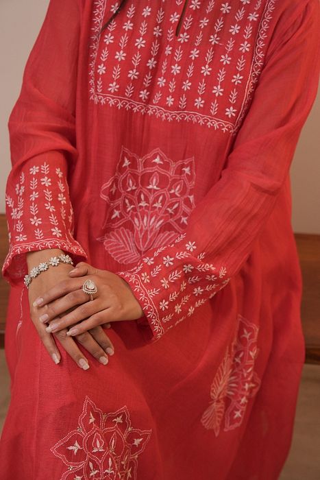 A model showcasing Red Chikankari Kurta Set by Myra By Anju Narian from Myra By Anju Narian's collection A model showcasing Red Chikankari Kurta Set by Myra By Anju Narian from Myra By Anju Narian's collection