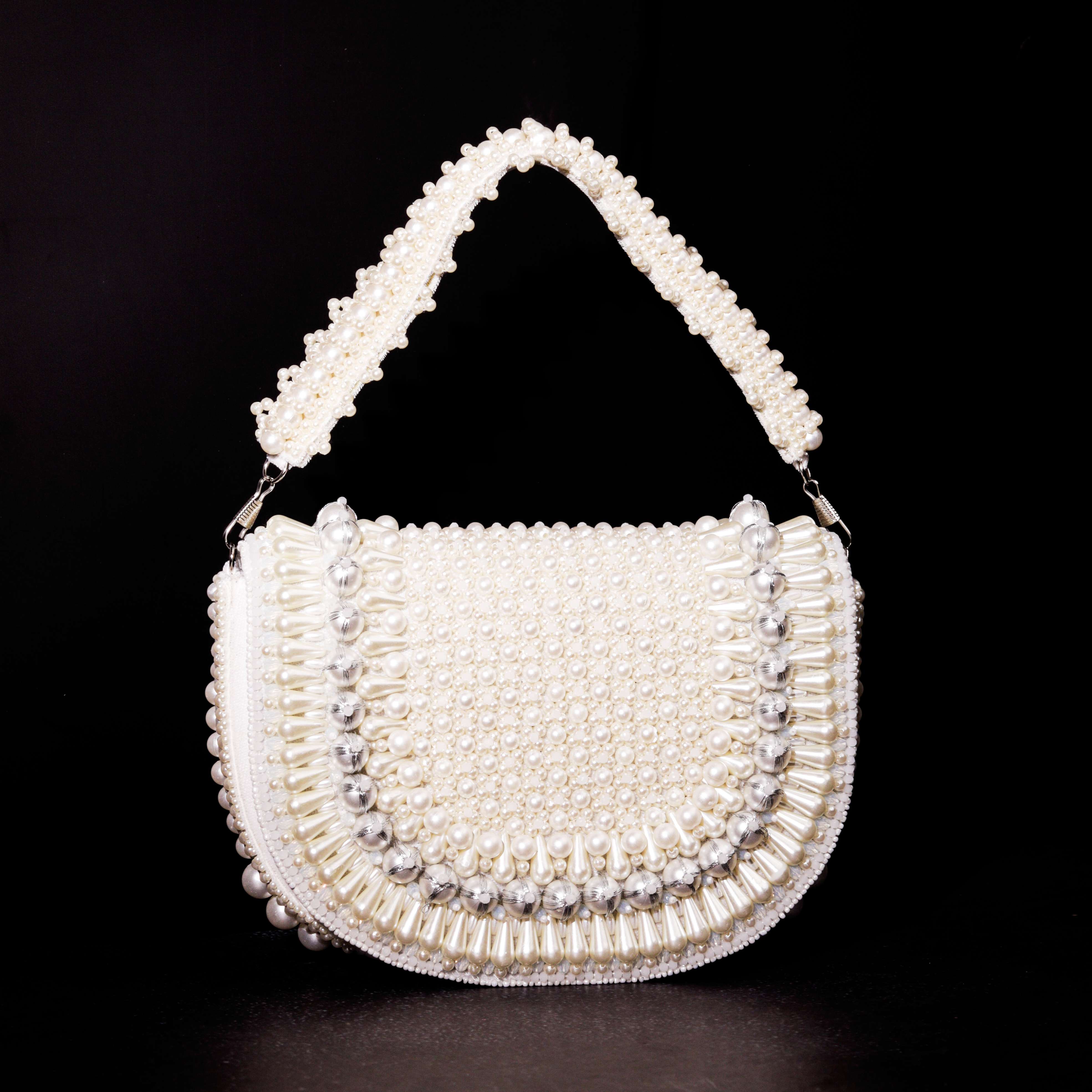 A model showcasing Pearl Pakizaa Clutch by The Purple Sack from The Purple Sack's collection