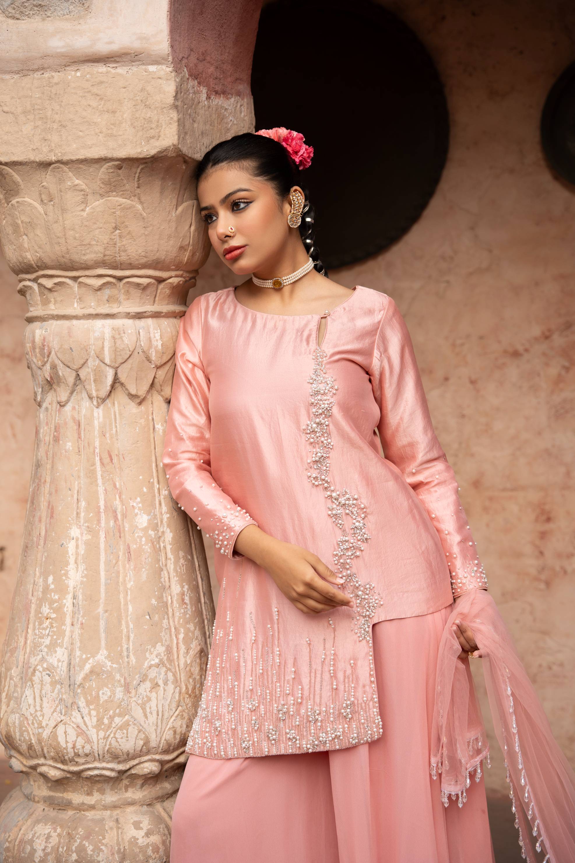 A model showcasing Blush Pink Handembroidered Sharara Set by Nikunj from Nikunj's collection