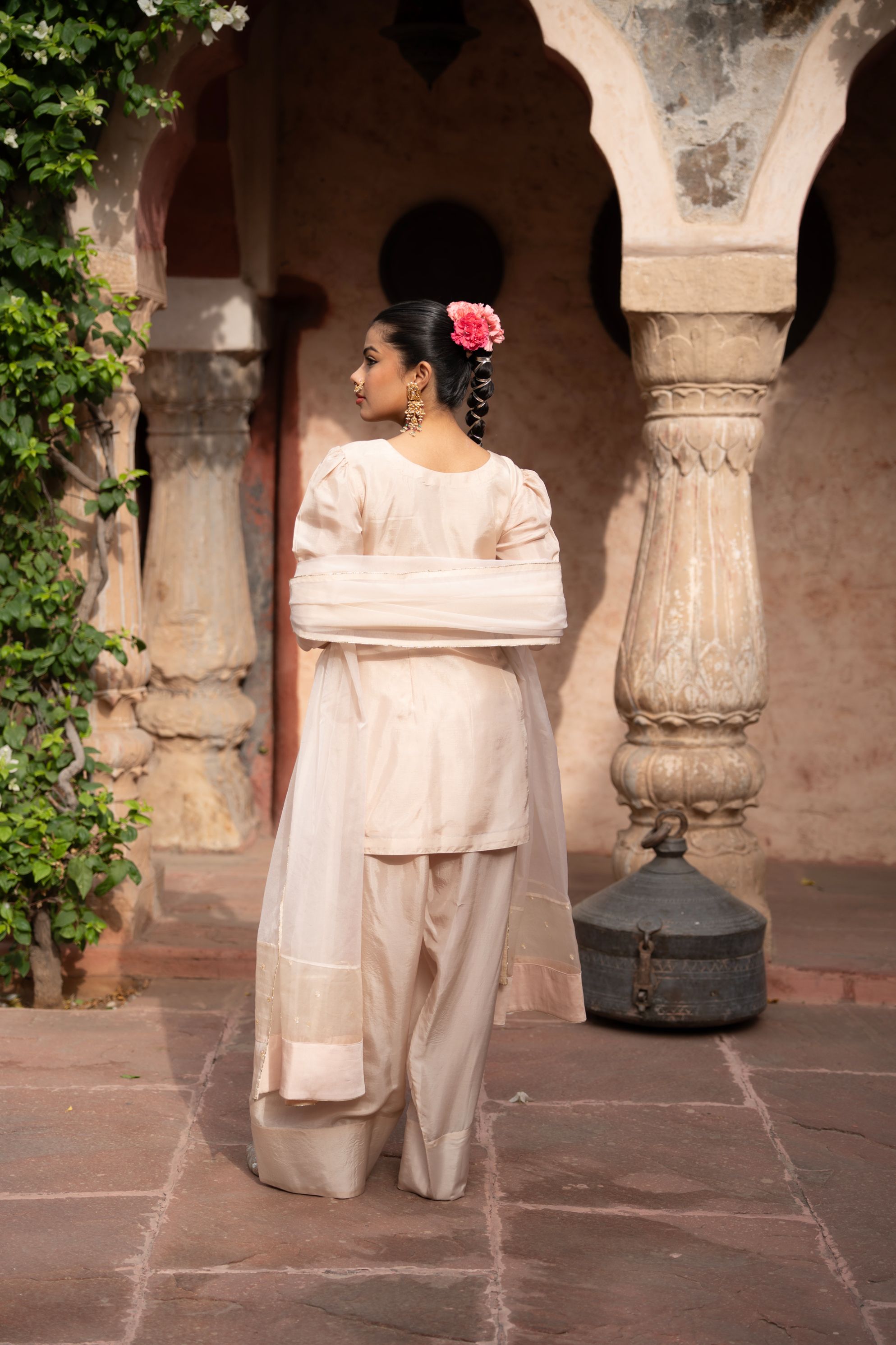 A model showcasing Warm Ivory Handembroidered Farshi Set by Nikunj from Nikunj's collection