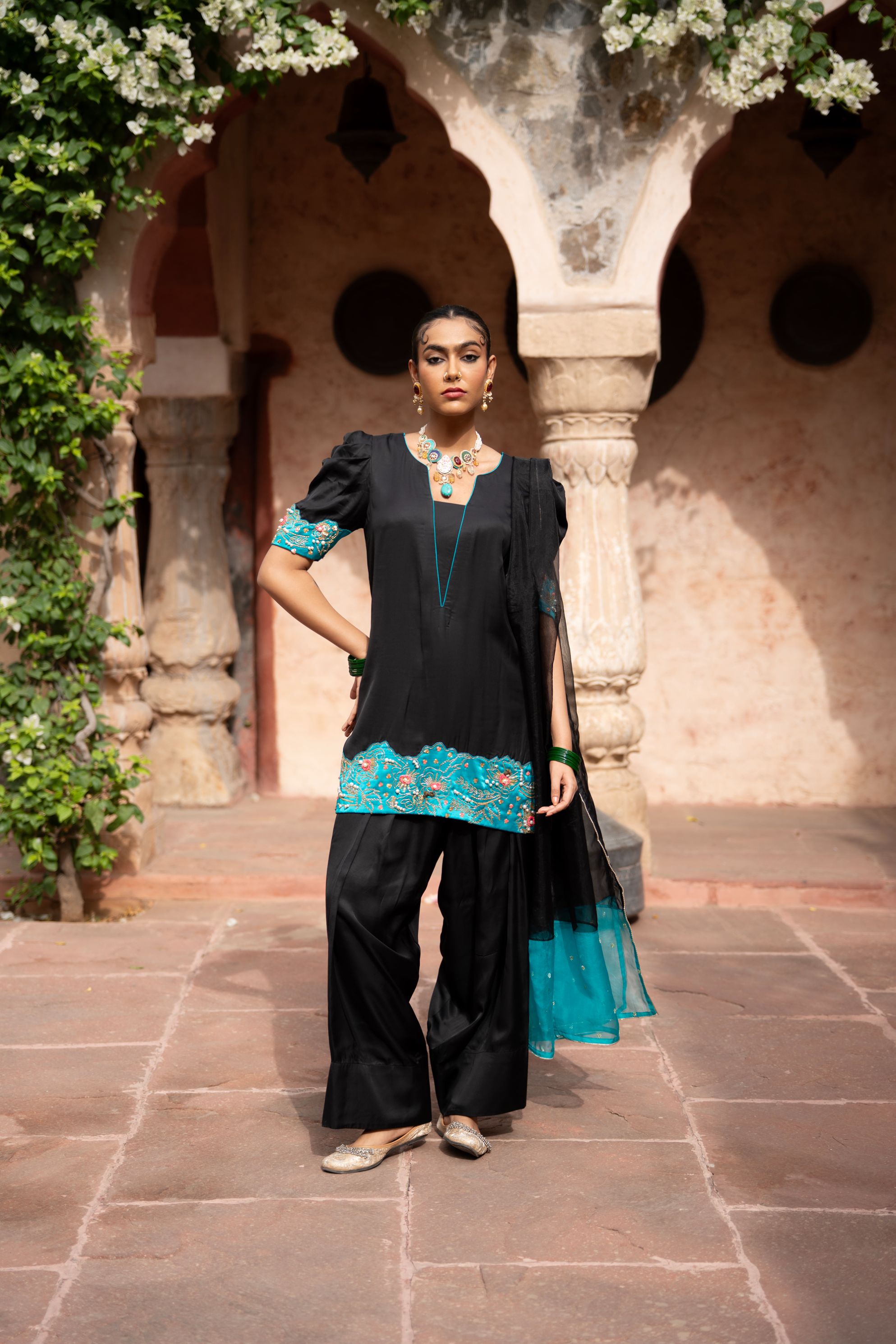 A model showcasing Midnight Noir Handembroidered Farshi Set by Nikunj from Nikunj's collection
