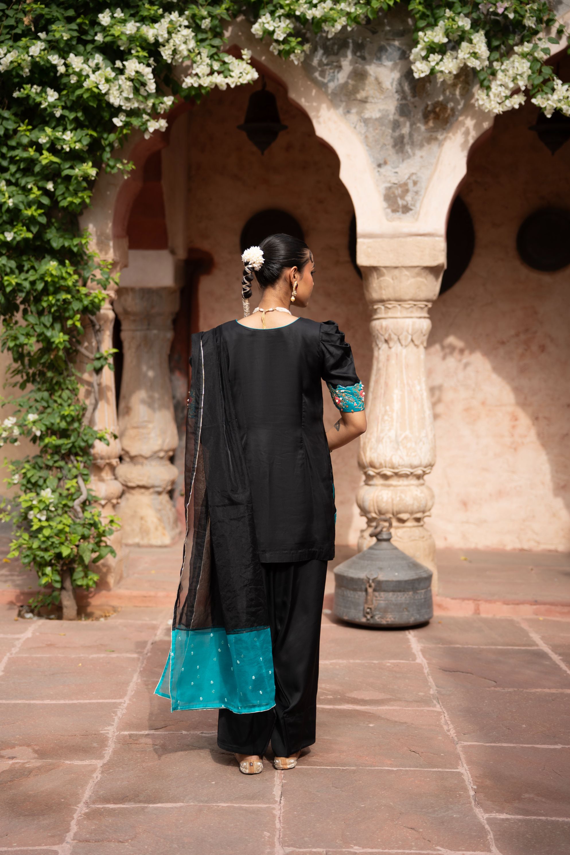 A model showcasing Midnight Noir Handembroidered Farshi Set by Nikunj from Nikunj's collection