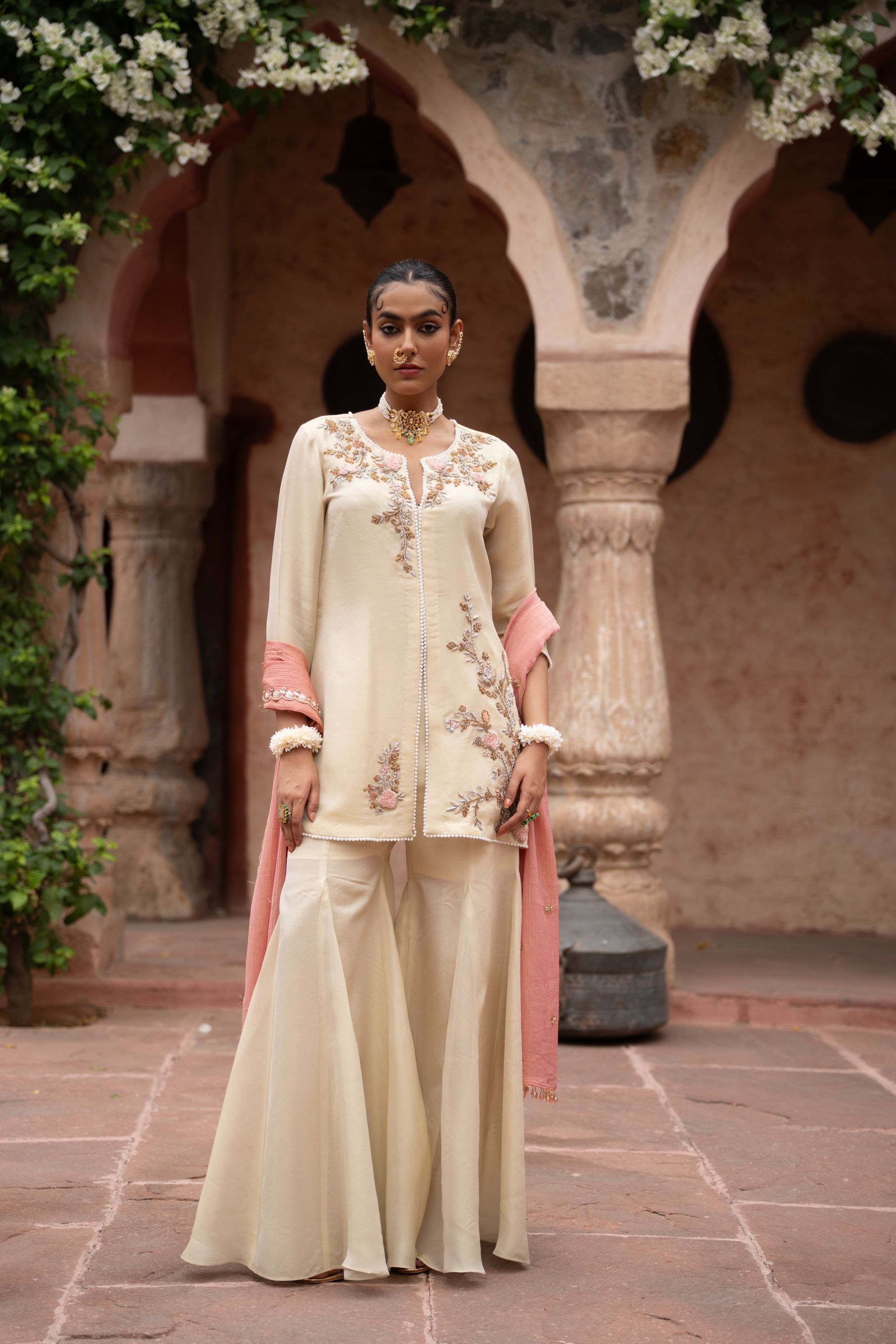 A model showcasing Gulbahaar Handembroidered Gharara Set by Nikunj from Nikunj's collection