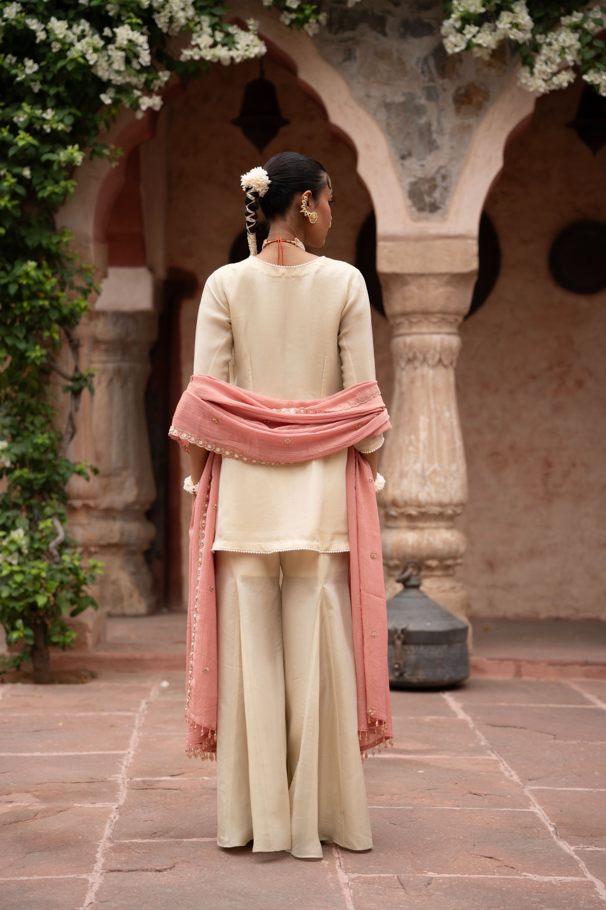 A model showcasing Gulbahaar Handembroidered Gharara Set by Nikunj from Nikunj's collection