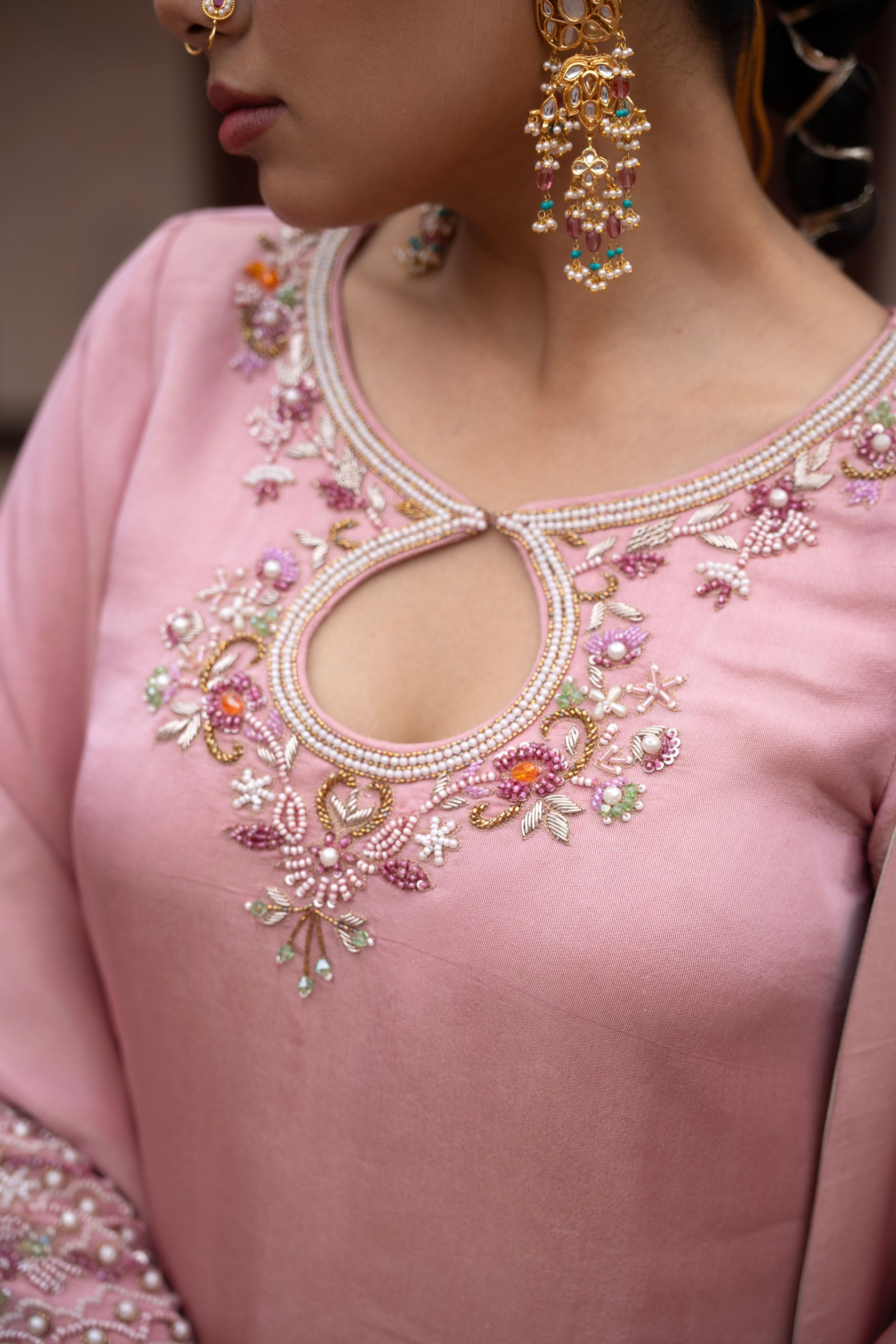 A model showcasing Noor Gulabi Handembroidered Dhoti Set by Nikunj from Nikunj's collection
