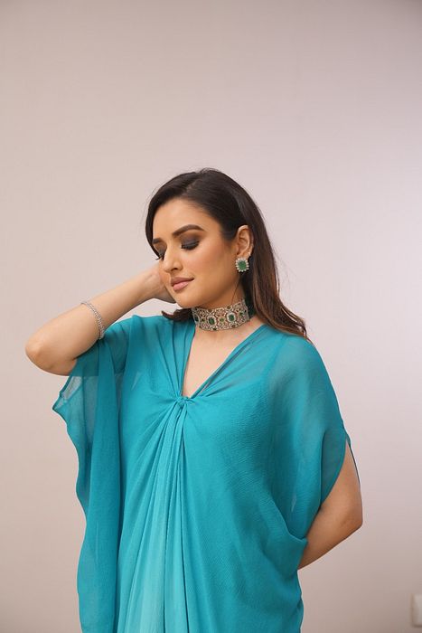A model showcasing Firoza Shaded Chikankari Dress by Myra By Anju Narian from Myra By Anju Narian's collection A model showcasing Firoza Shaded Chikankari Dress by Myra By Anju Narian from Myra By Anju Narian's collection