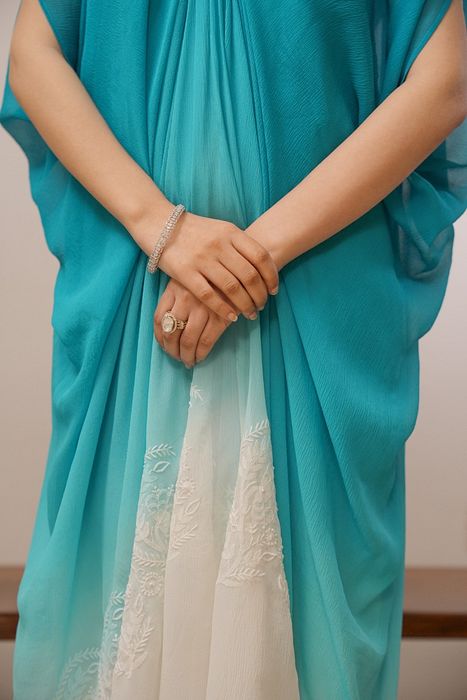 A model showcasing Firoza Shaded Chikankari Dress by Myra By Anju Narian from Myra By Anju Narian's collection A model showcasing Firoza Shaded Chikankari Dress by Myra By Anju Narian from Myra By Anju Narian's collection