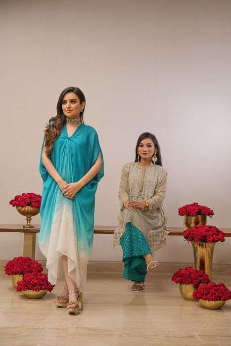 A model showcasing Firoza Shaded Chikankari Dress by Myra By Anju Narian from Myra By Anju Narian's collection A model showcasing Firoza Shaded Chikankari Dress by Myra By Anju Narian from Myra By Anju Narian's collection