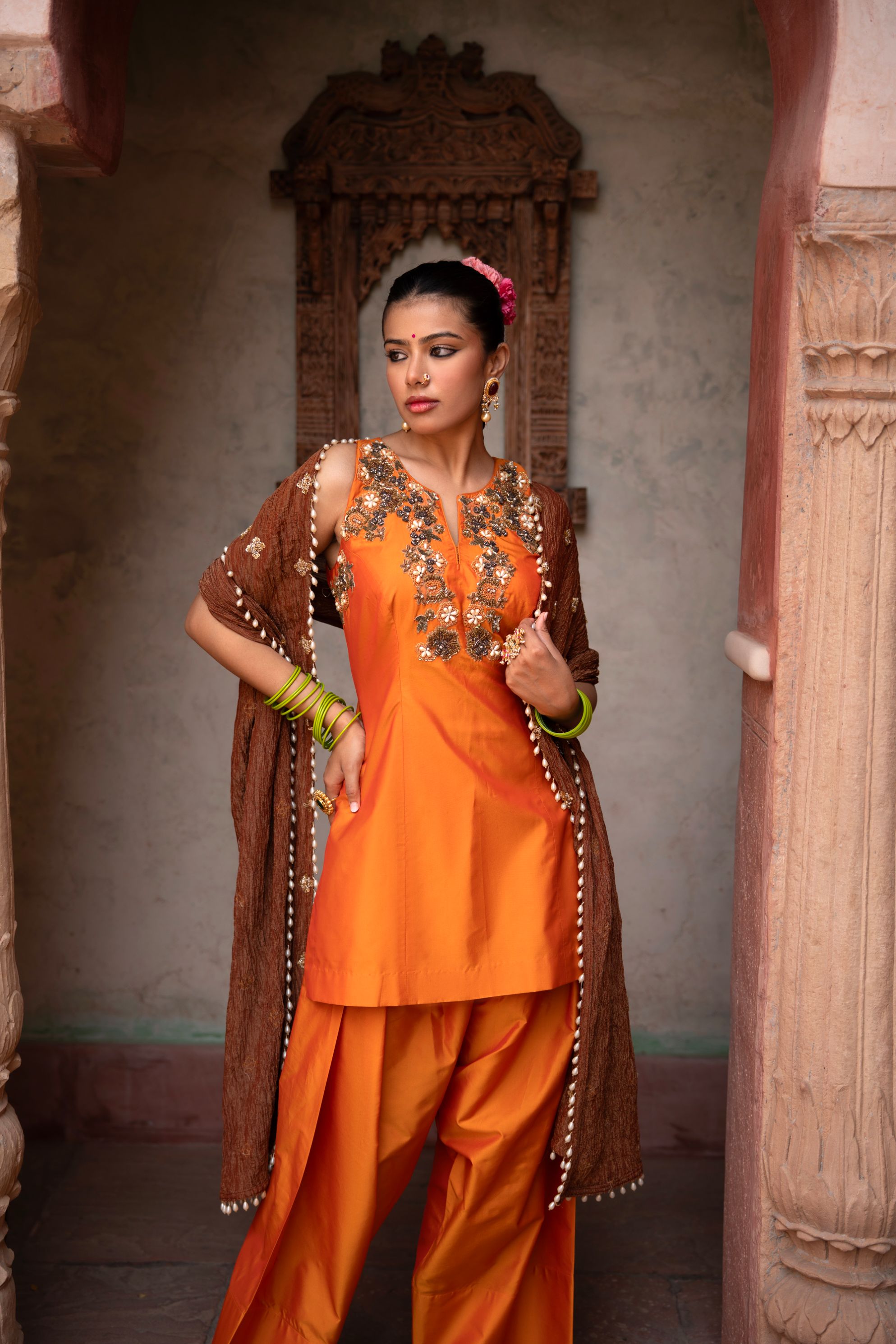A model showcasing Kesariya Noor Handembroidered Farshi Set by Nikunj from Nikunj's collection