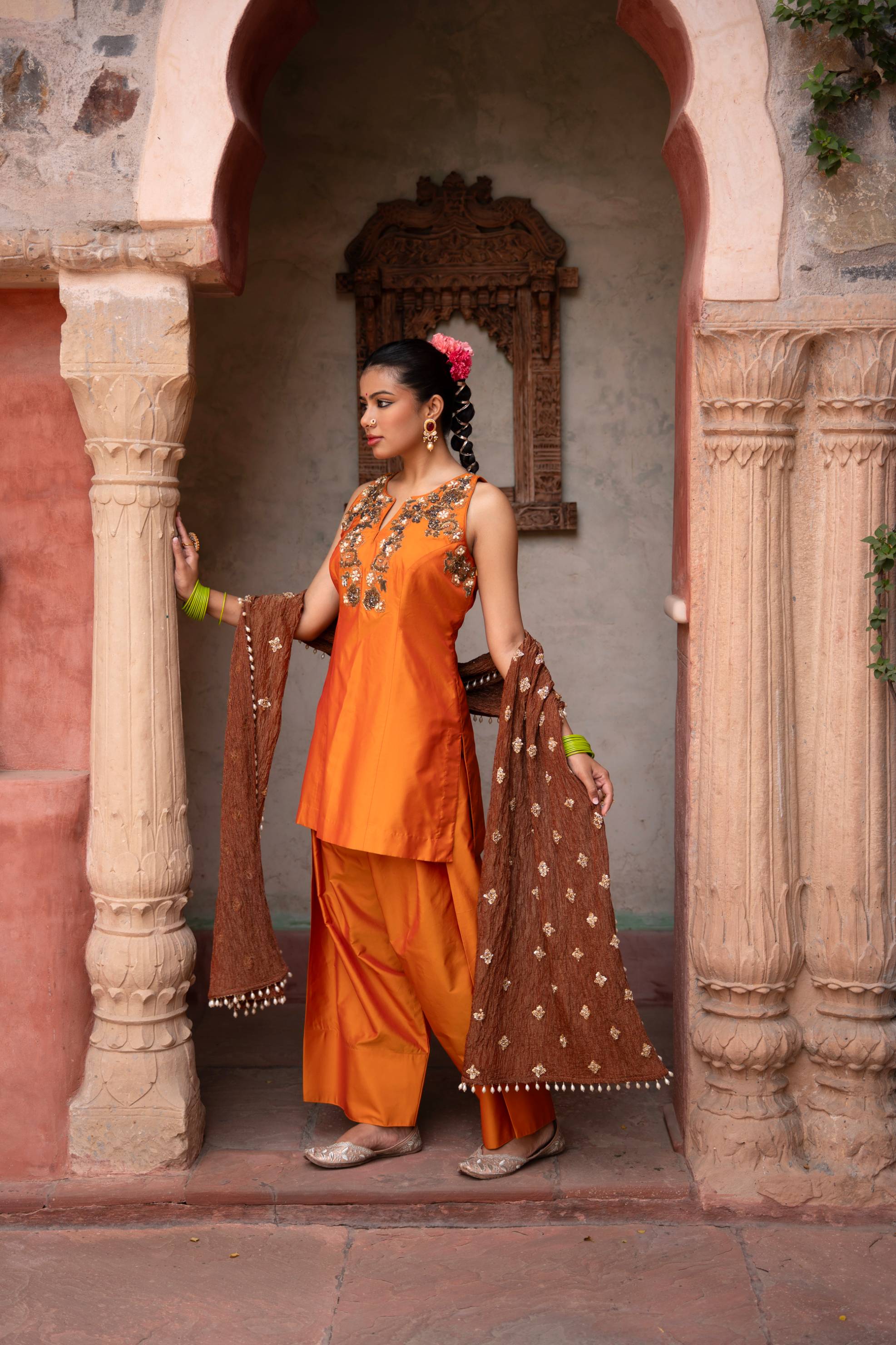 A model showcasing Kesariya Noor Handembroidered Farshi Set by Nikunj from Nikunj's collection