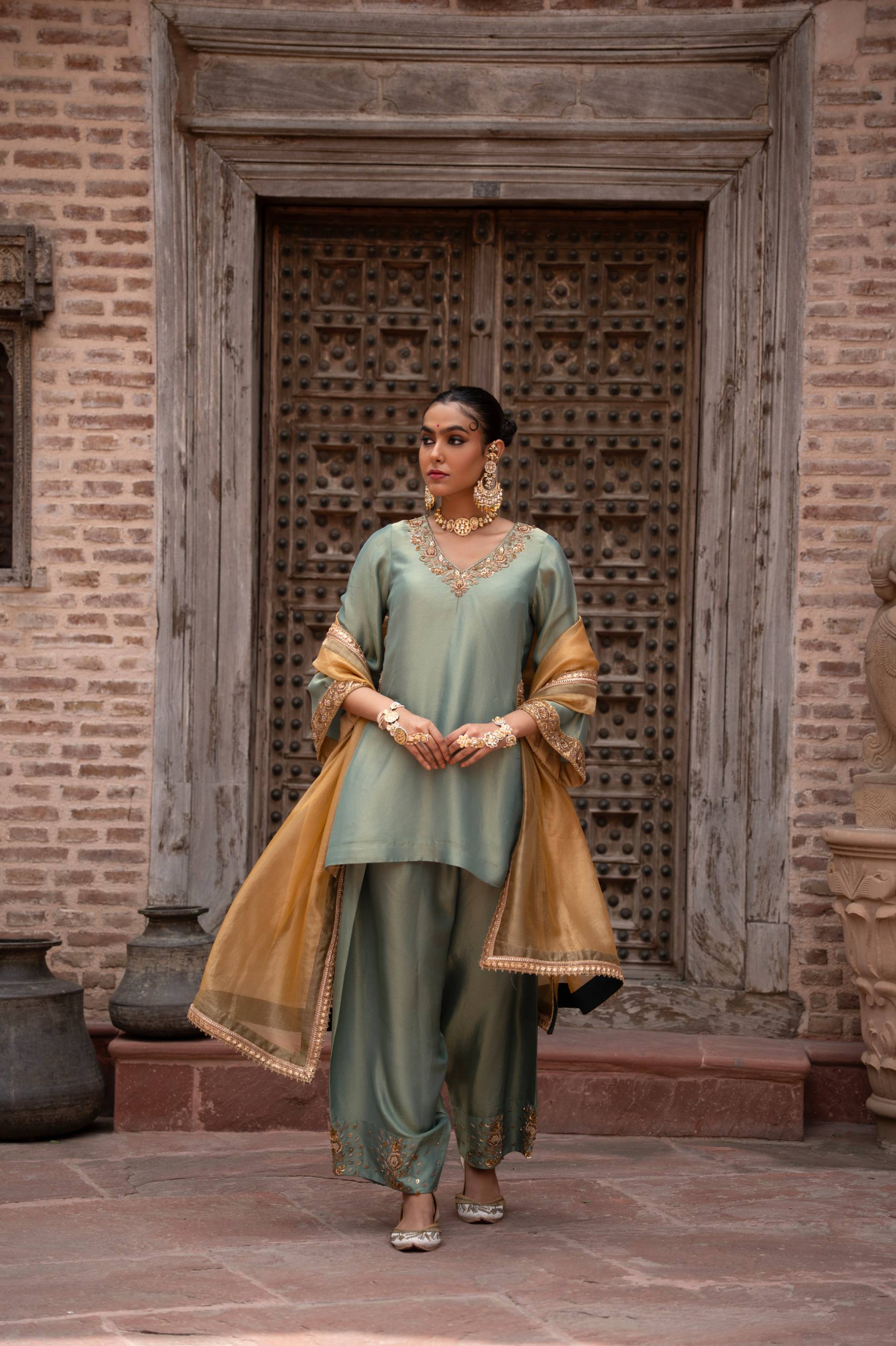 A model showcasing Pista Noor Handembroidered Farshi Set by Nikunj from Nikunj's collection