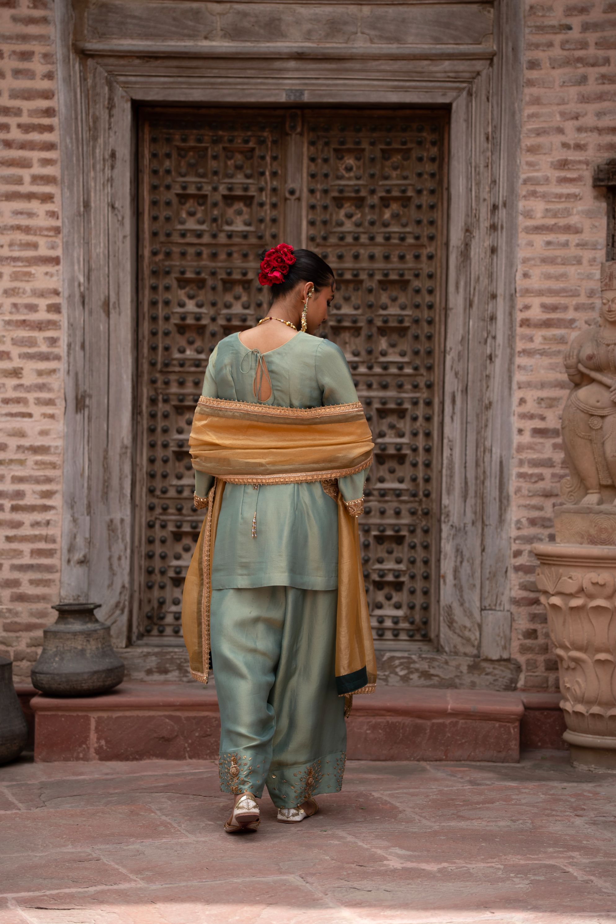 A model showcasing Pista Noor Handembroidered Farshi Set by Nikunj from Nikunj's collection