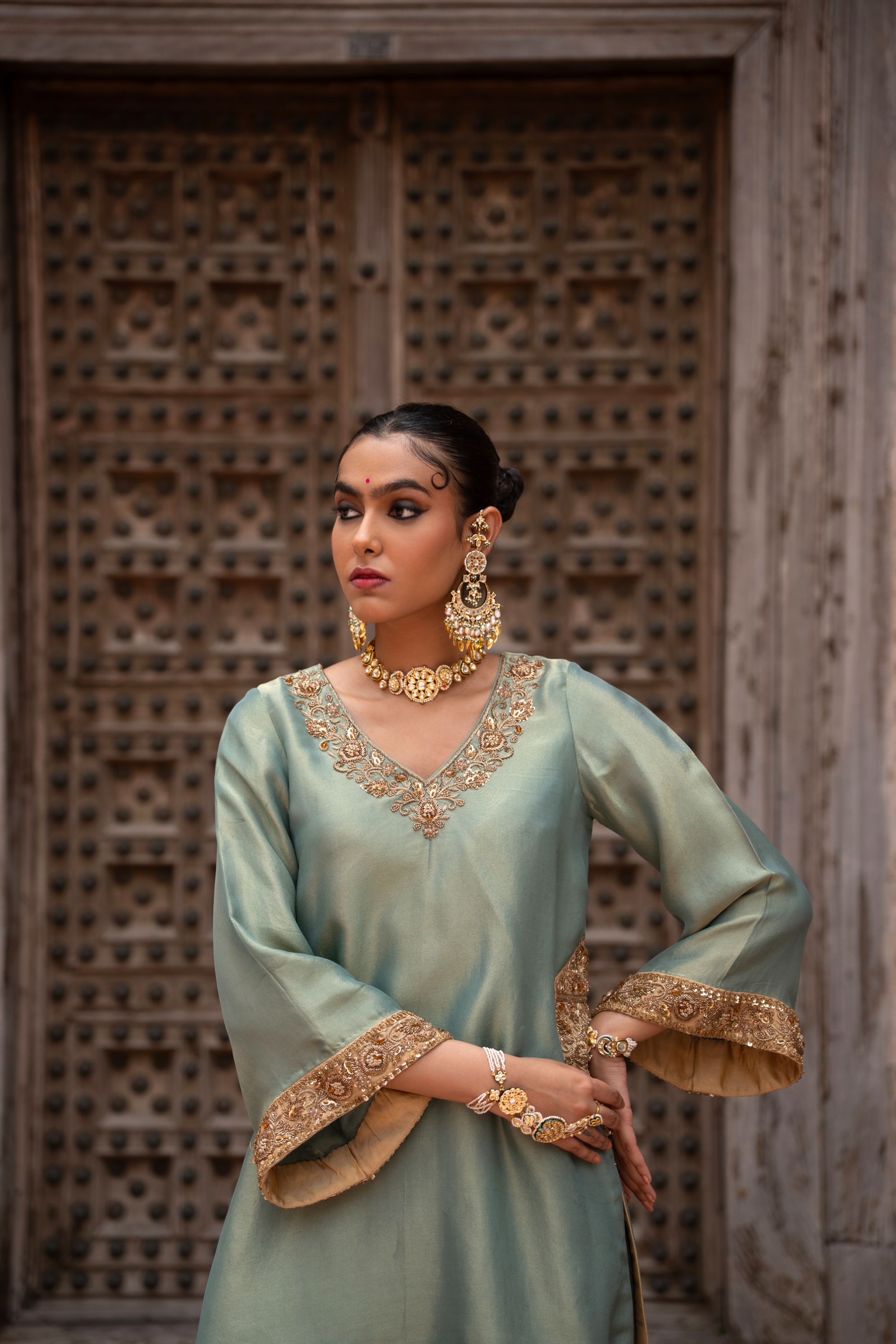 A model showcasing Pista Noor Handembroidered Farshi Set by Nikunj from Nikunj's collection