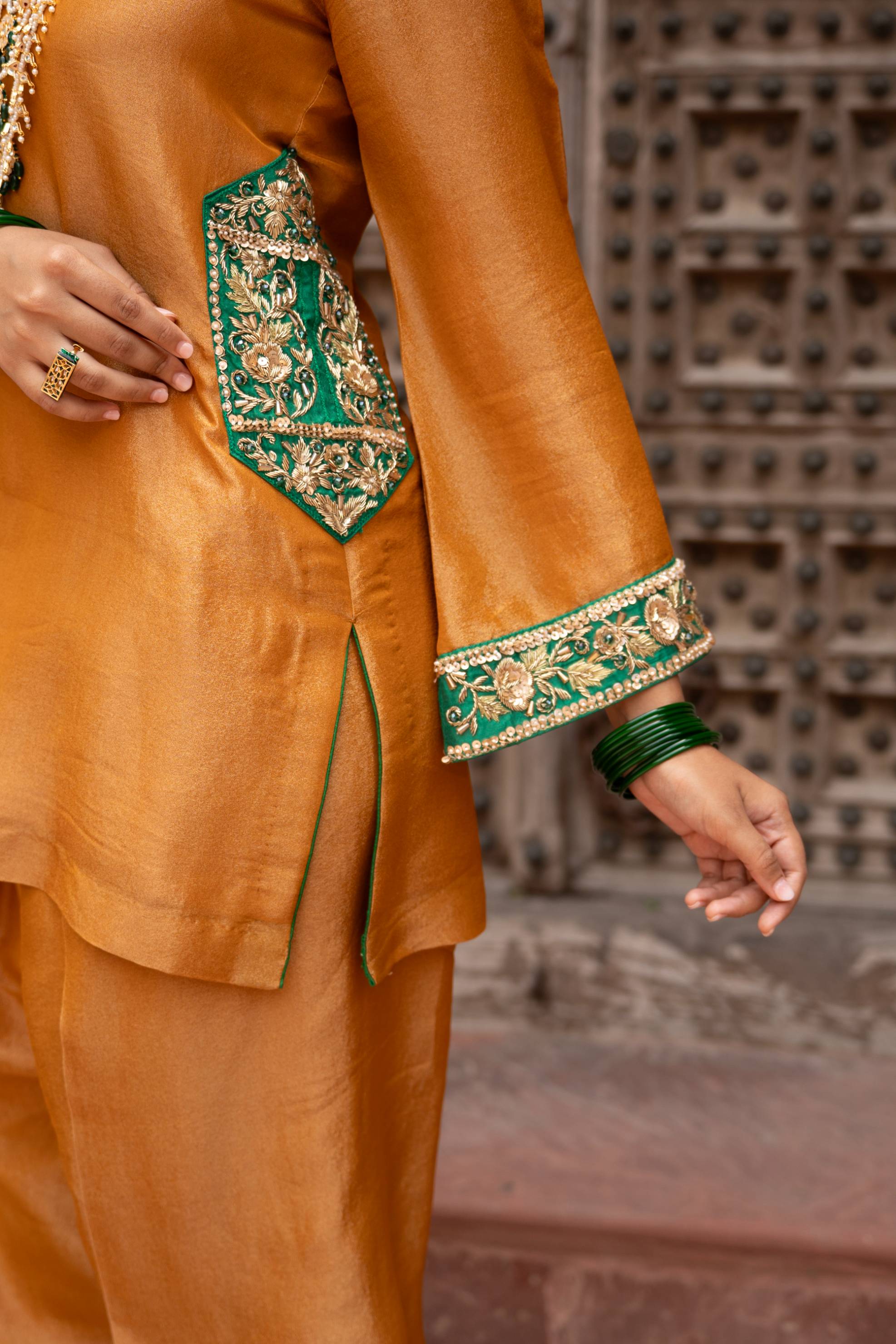 A model showcasing Surmayi Sunehri Handembroidered Balloon Salwar Set by Nikunj from Nikunj's collection