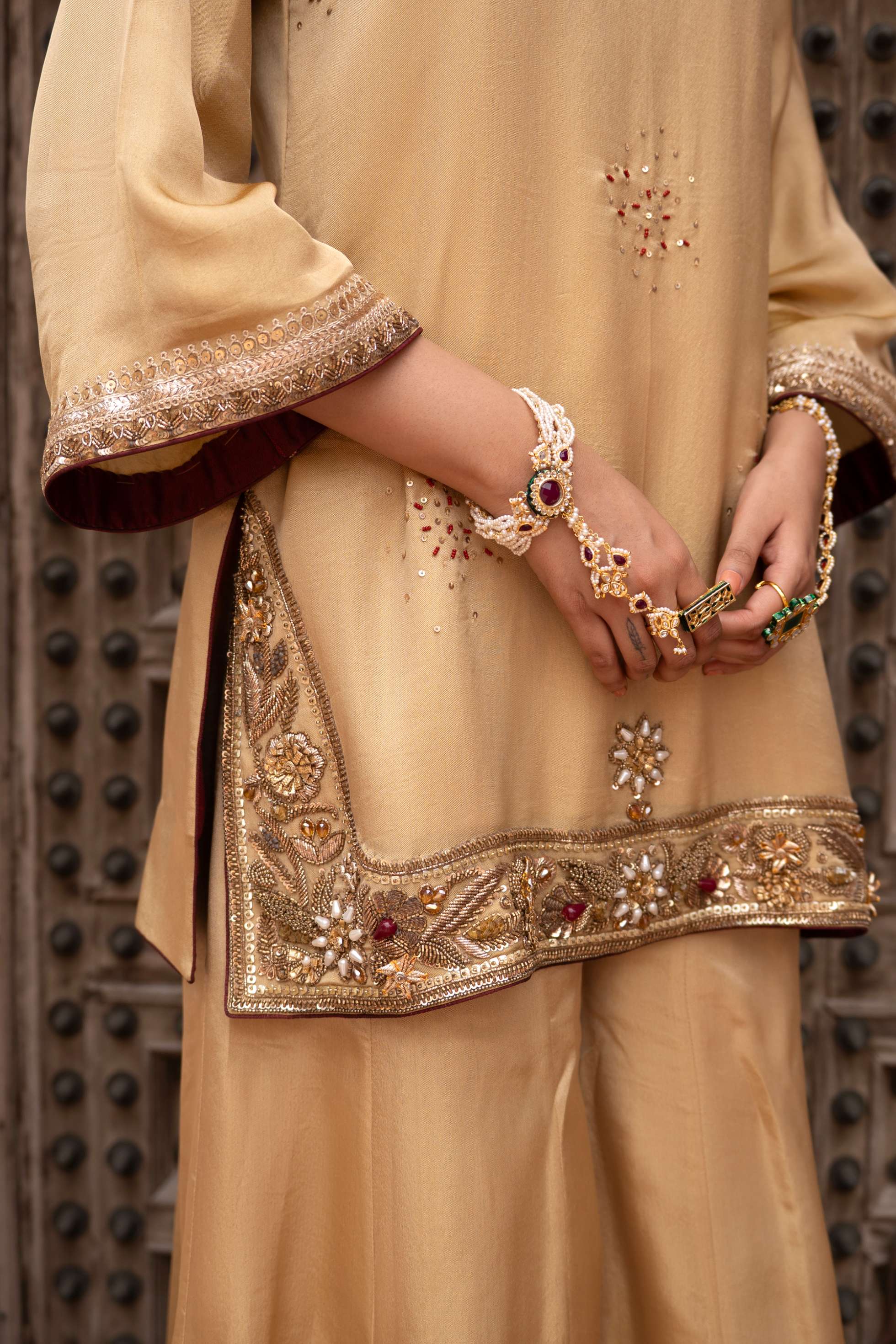 A model showcasing Noorezar Handembroidered Sharara Set by Nikunj from Nikunj's collection