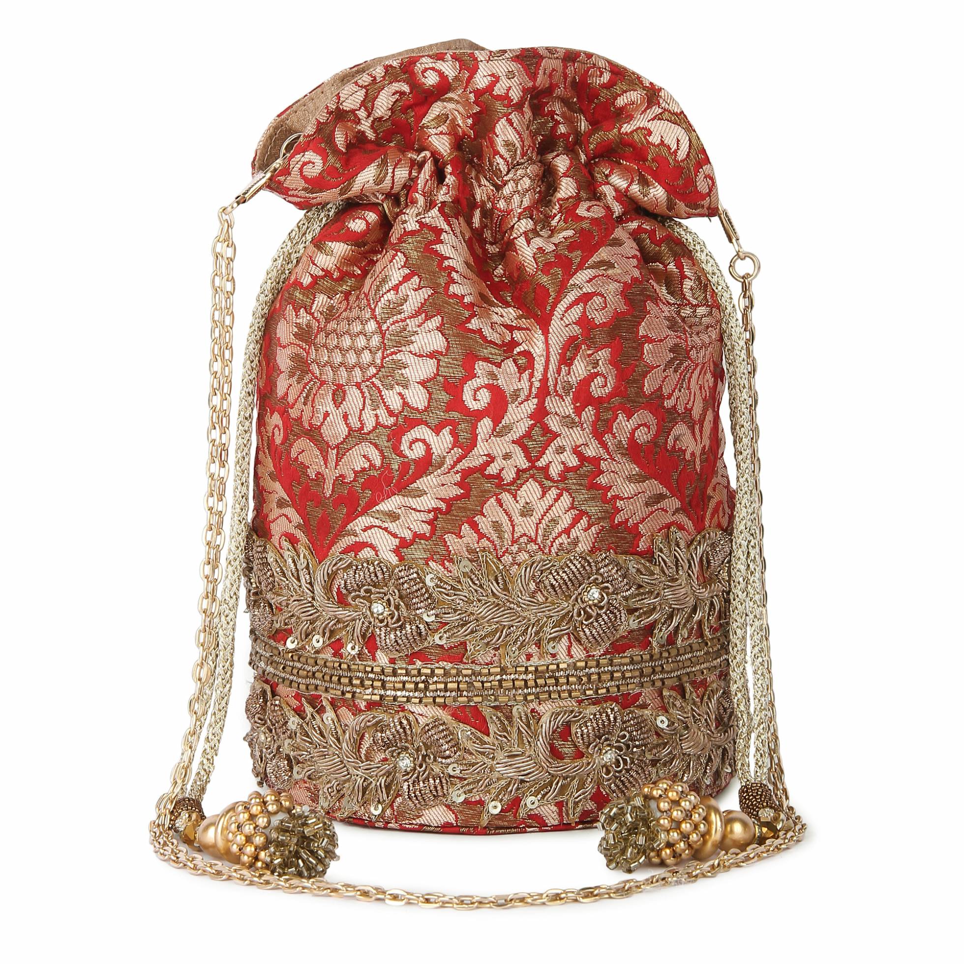 A model showcasing Red Brocade Potli by The Purple Sack from The Purple Sack's collection