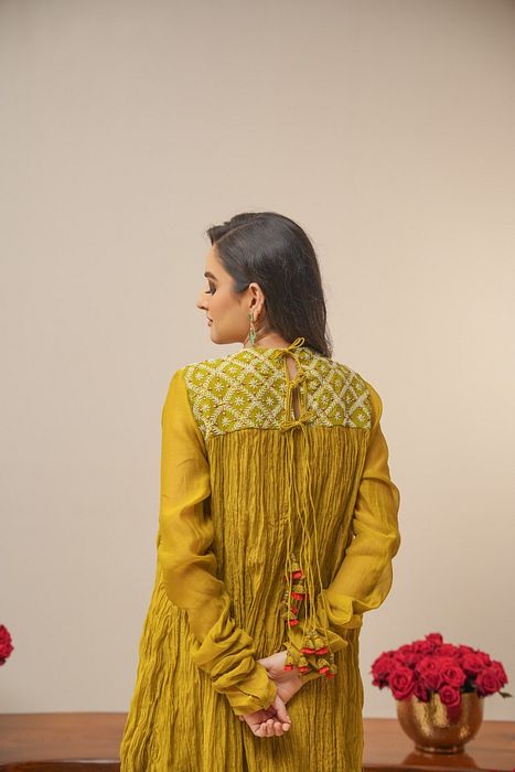 A model showcasing Olive Crush Kurta With Pants by Myra By Anju Narian from Myra By Anju Narian's collection A model showcasing Olive Crush Kurta With Pants by Myra By Anju Narian from Myra By Anju Narian's collection