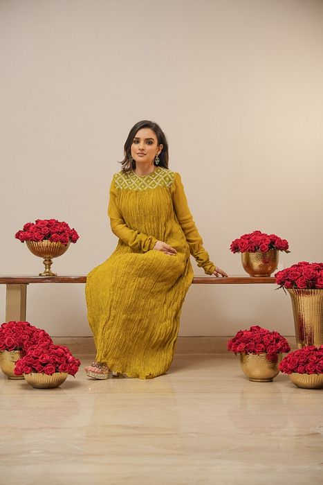 A model showcasing Olive Crush Kurta With Pants by Myra By Anju Narian from Myra By Anju Narian's collection A model showcasing Olive Crush Kurta With Pants by Myra By Anju Narian from Myra By Anju Narian's collection