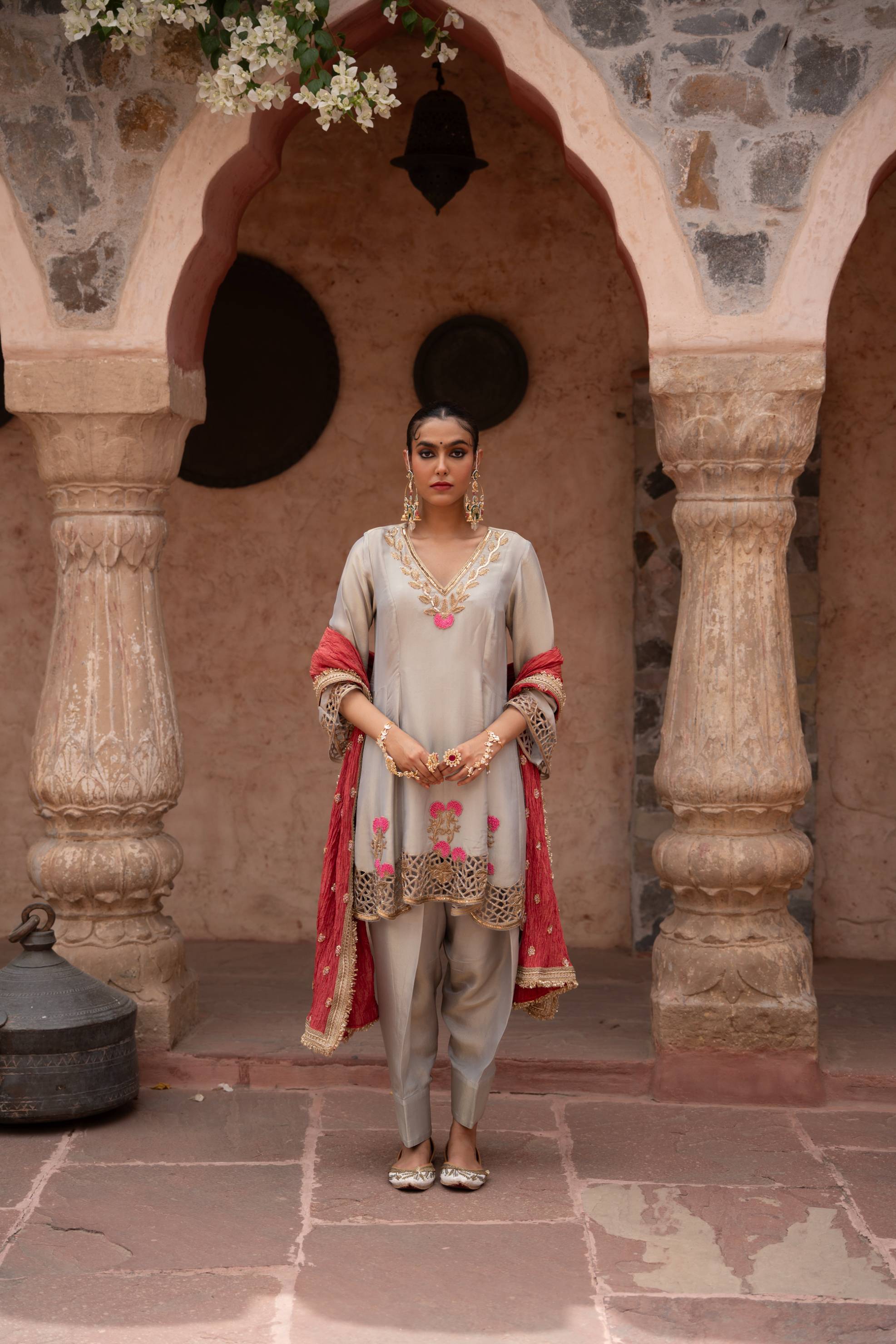 A model showcasing Chaand Baali Hand Embroidered Anarkali Set by Nikunj from Nikunj's collection
