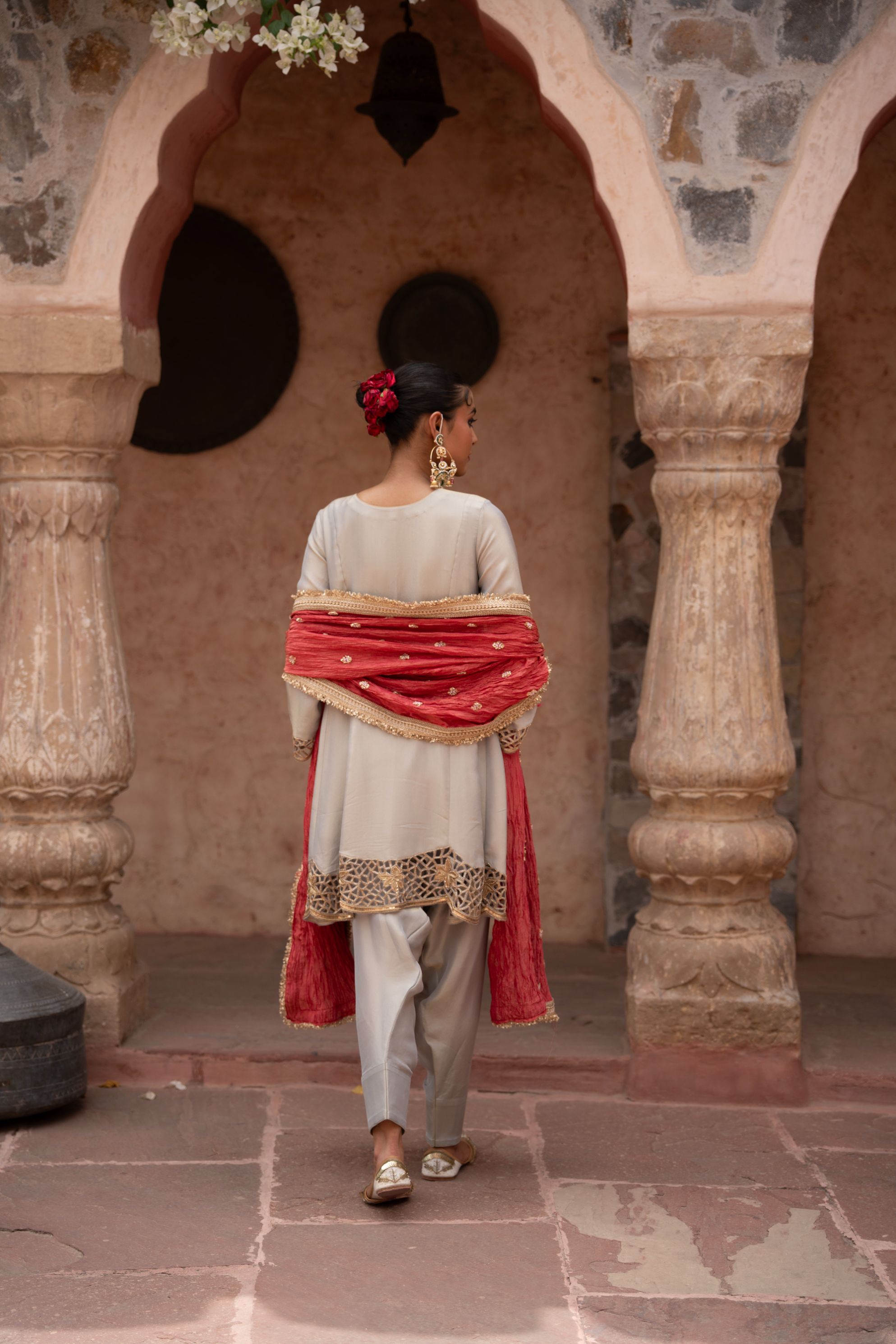 A model showcasing Chaand Baali Hand Embroidered Anarkali Set by Nikunj from Nikunj's collection