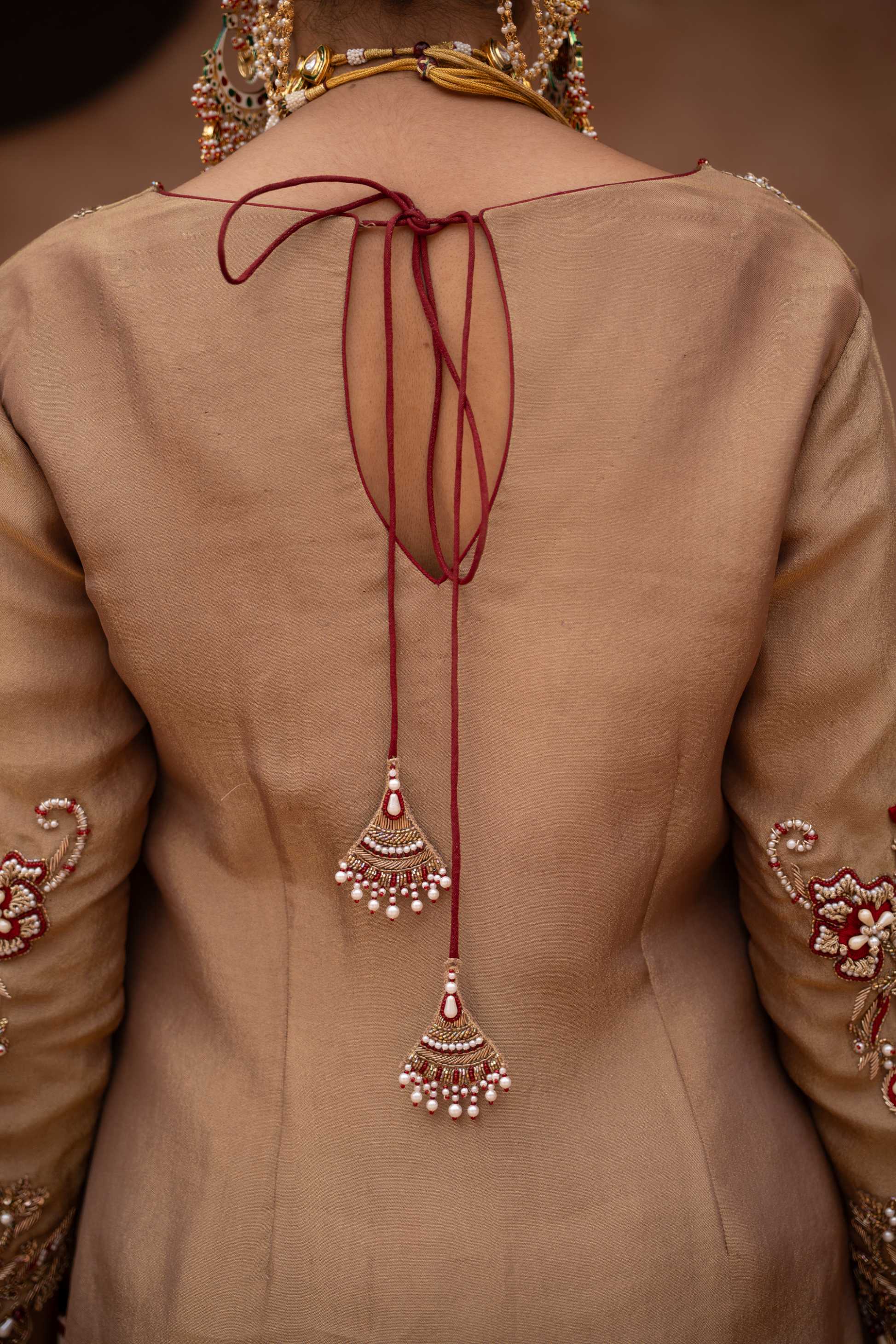 A model showcasing Zehra Handembroidered Farshi Salwar Set by Nikunj from Nikunj's collection A model showcasing Zehra Handembroidered Farshi Salwar Set by Nikunj from Nikunj's collection