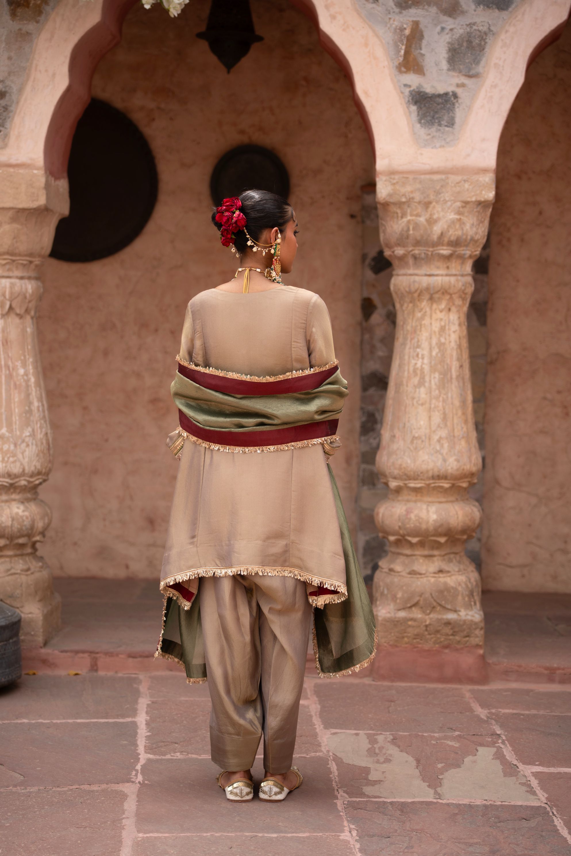 A model showcasing Noor Kaftan Hand Embroidered Salwar Set by Nikunj from Nikunj's collection A model showcasing Noor Kaftan Hand Embroidered Salwar Set by Nikunj from Nikunj's collection