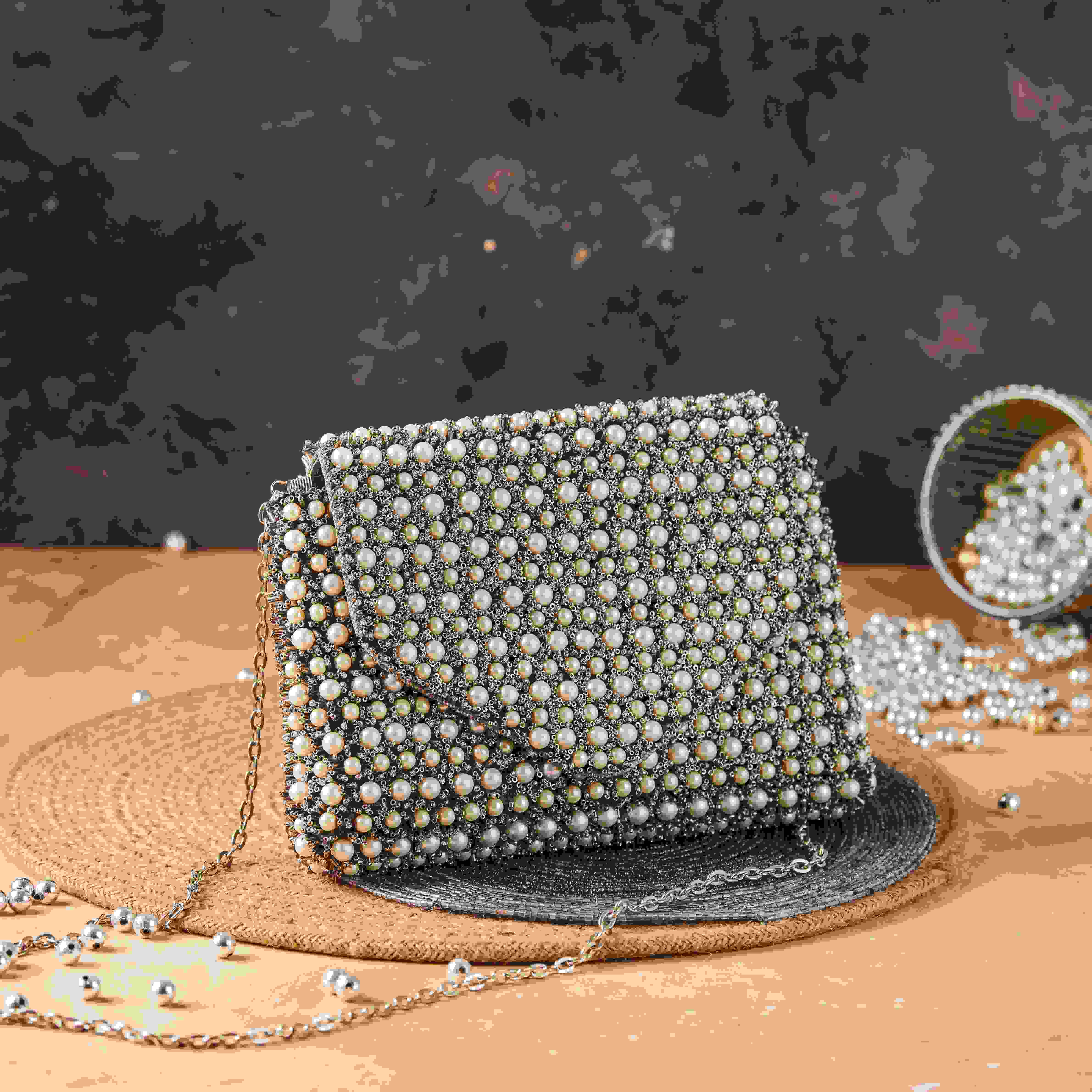 A model showcasing Nazakat Clutch by The Purple Sack from The Purple Sack's collection