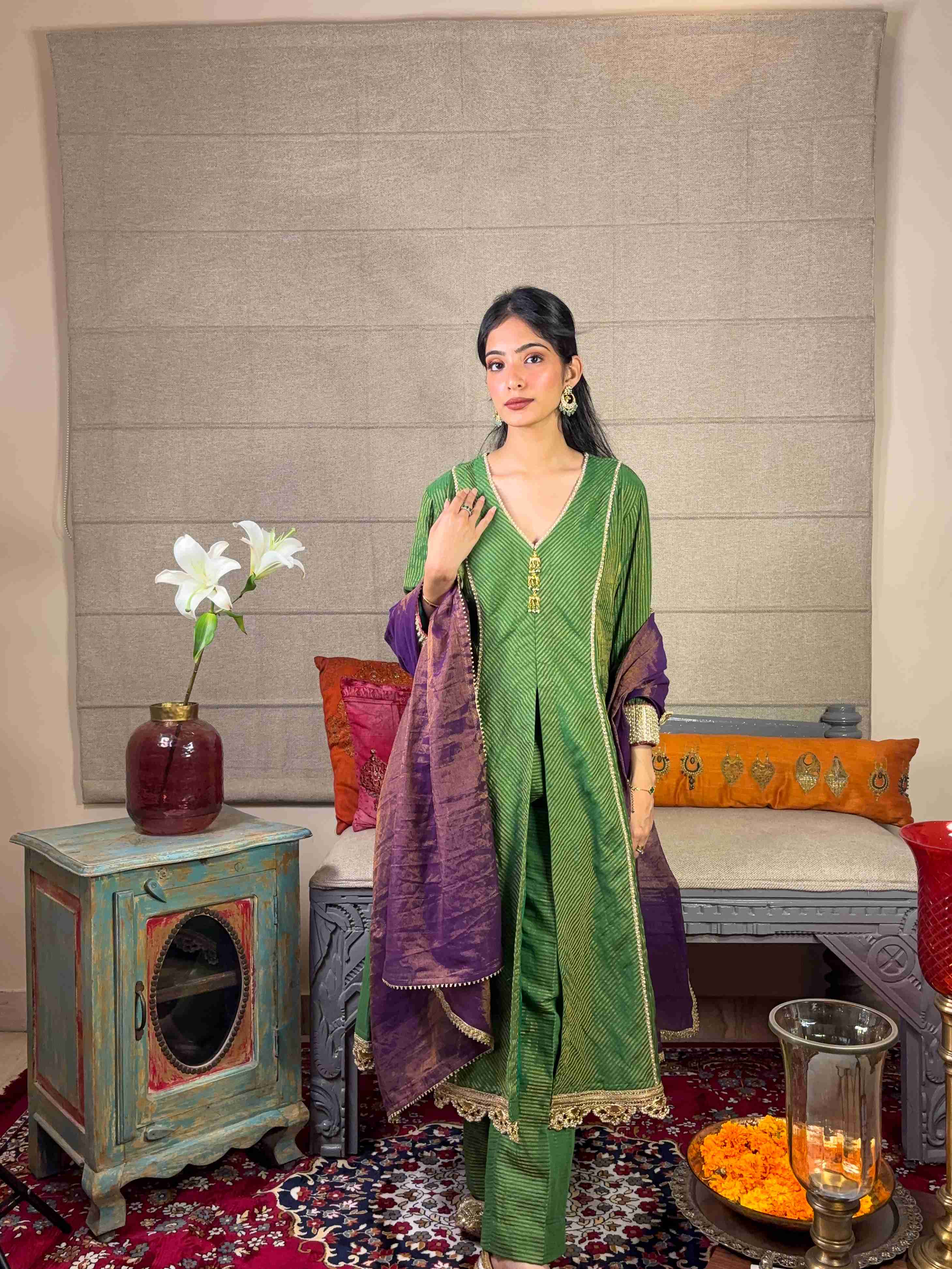 A model showcasing Banarsi Green Kurta With Straight Pants Set by Miithhii Elaychii from Miithhii Elaychii's collection