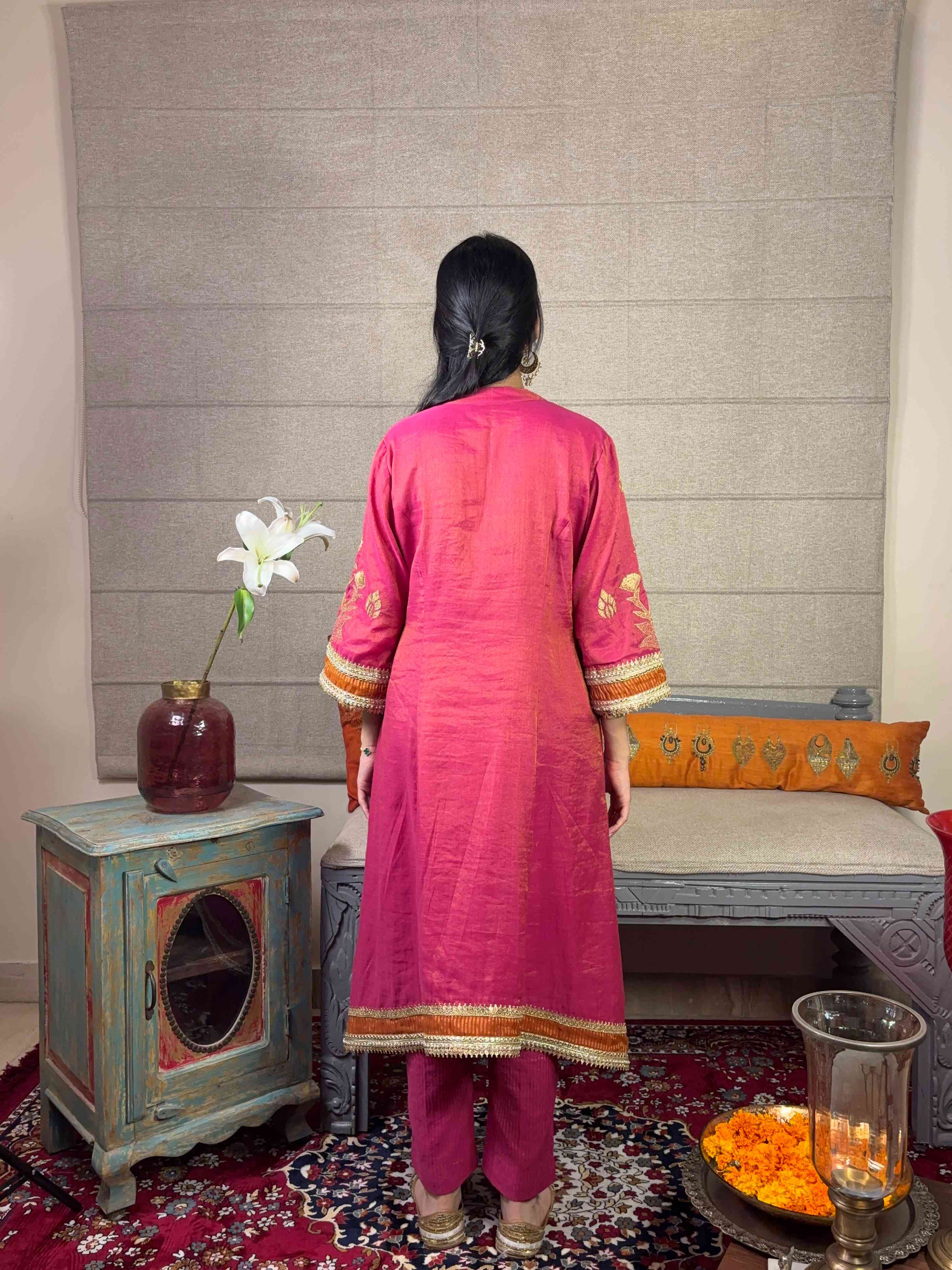A model showcasing Pink Aline Kurta With Linear Pants Set by Miithhii Elaychii from Miithhii Elaychii's collection