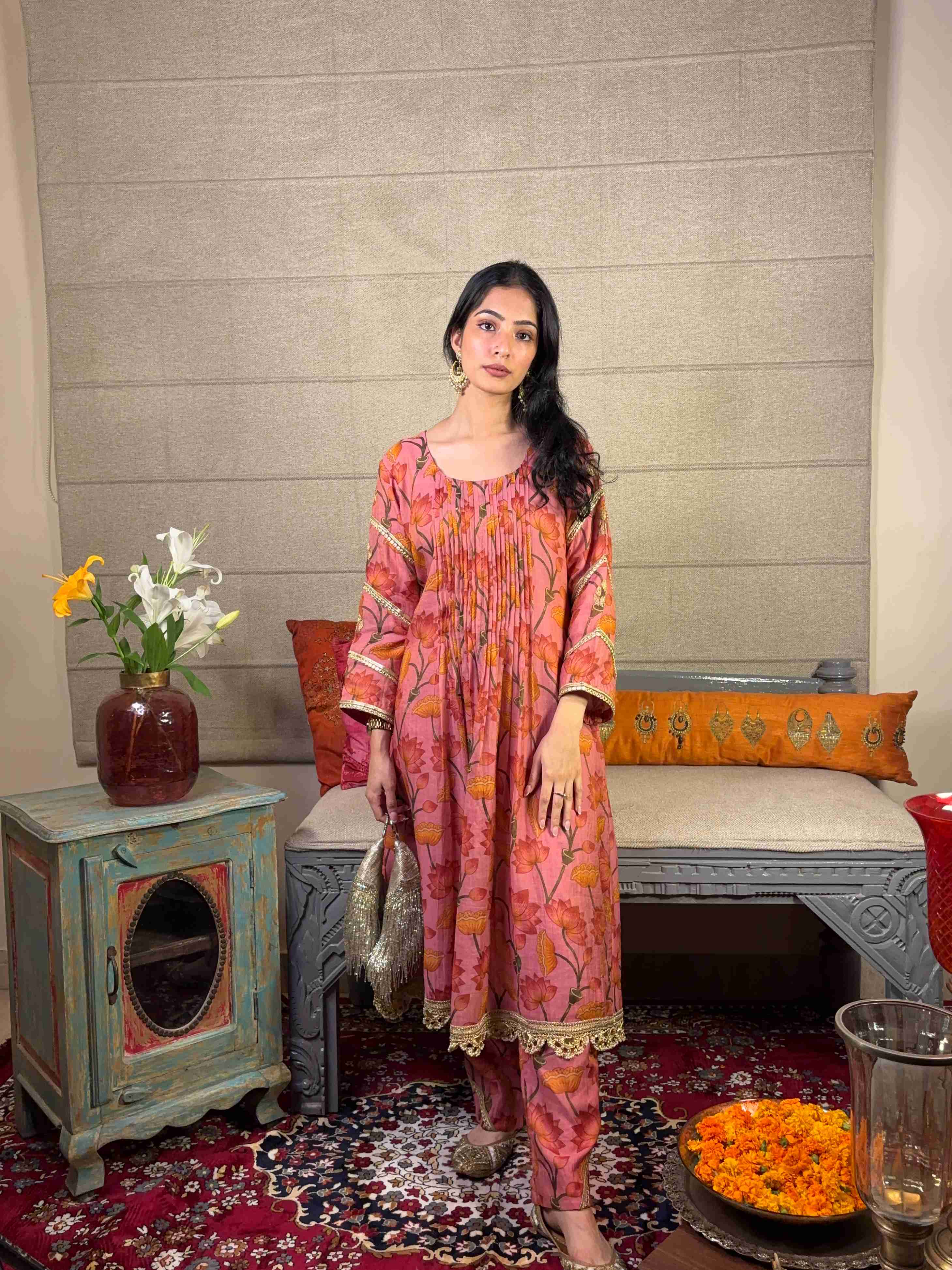 A model showcasing Pink Floral Kurta Pants Set by Miithhii Elaychii from Miithhii Elaychii's collection