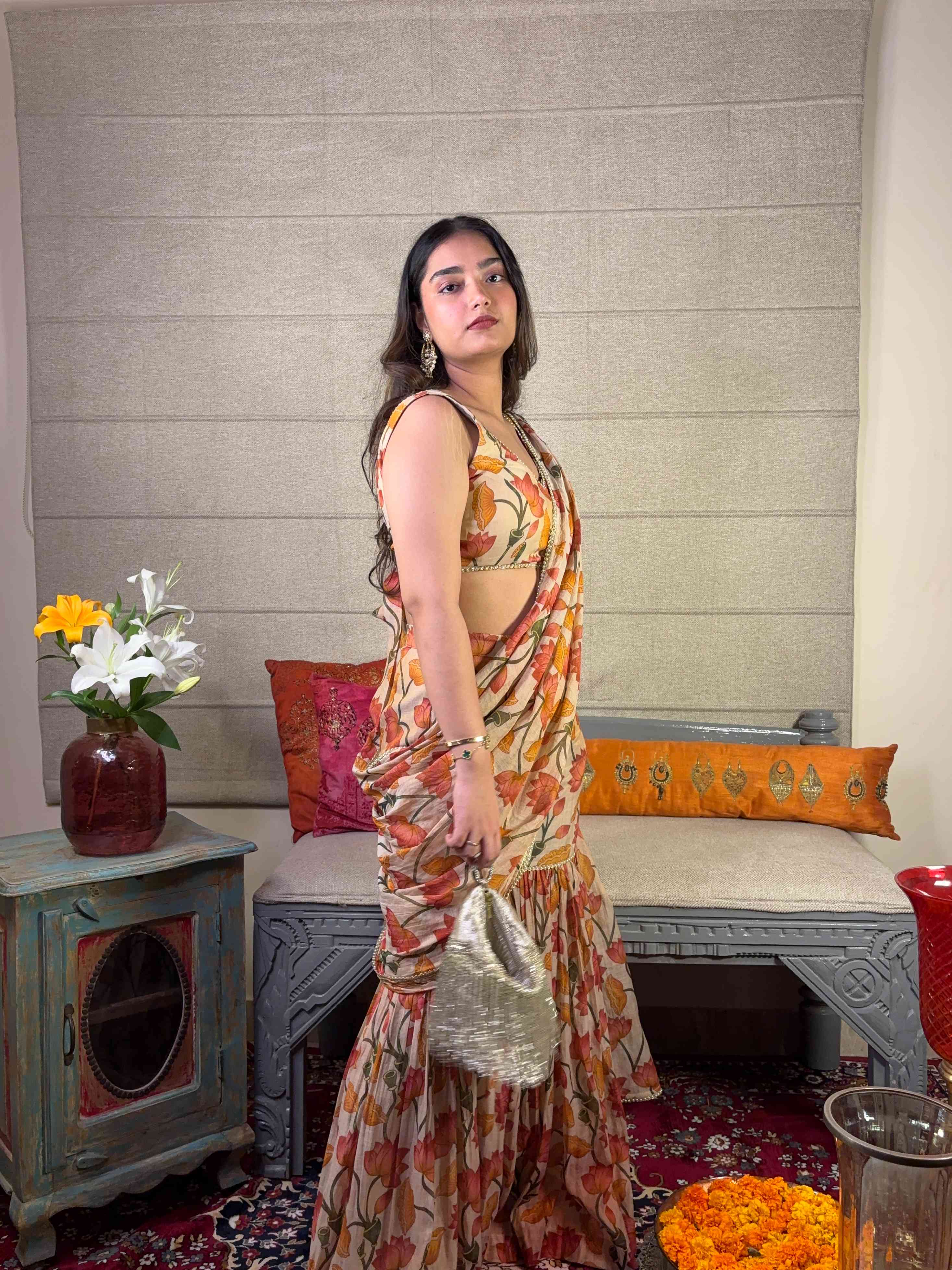 A model showcasing Floral Print Ivory Draped Saree Set by Miithhii Elaychii from Miithhii Elaychii's collection