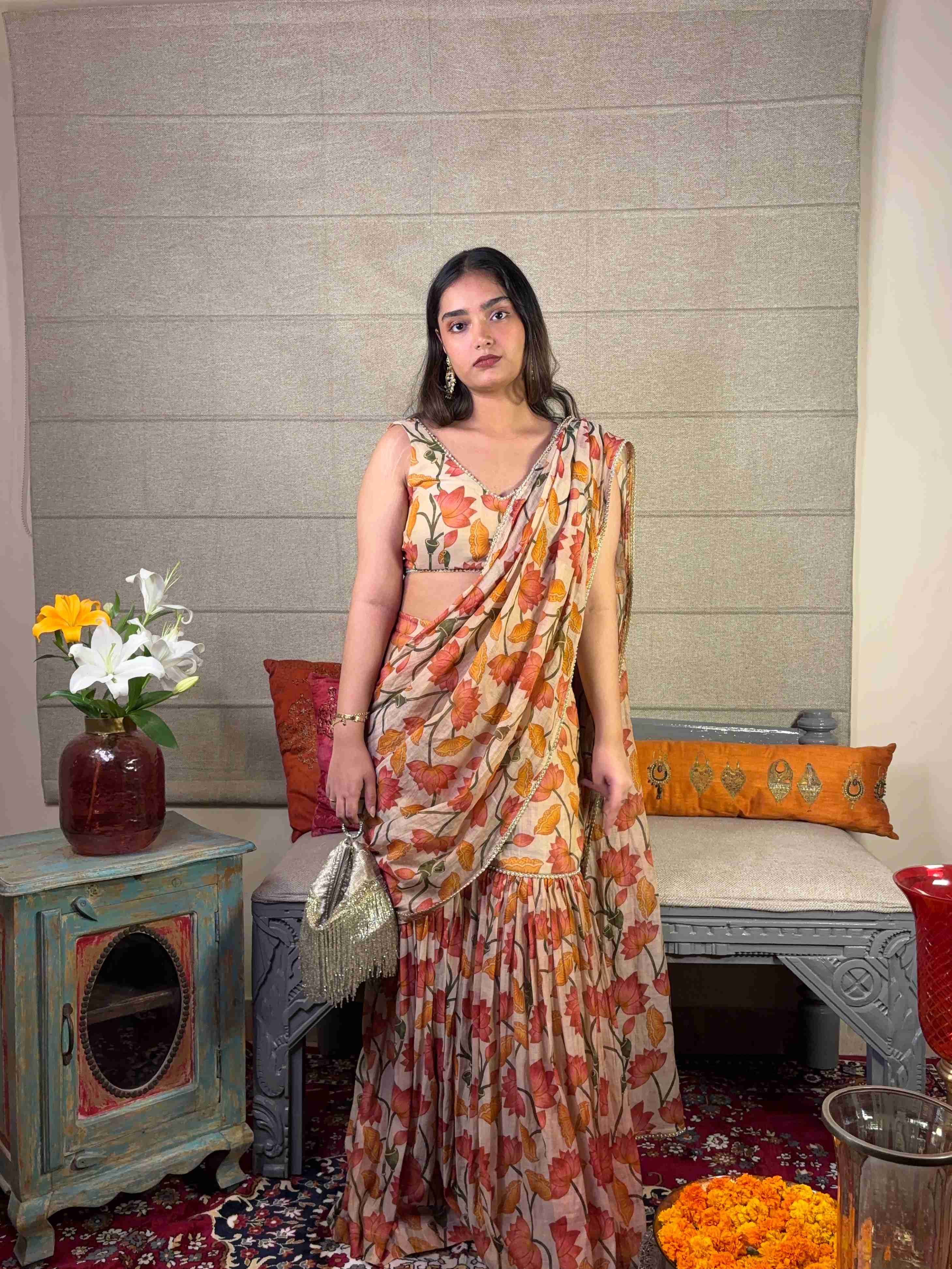 A model showcasing Floral Print Ivory Draped Saree Set by Miithhii Elaychii from Miithhii Elaychii's collection