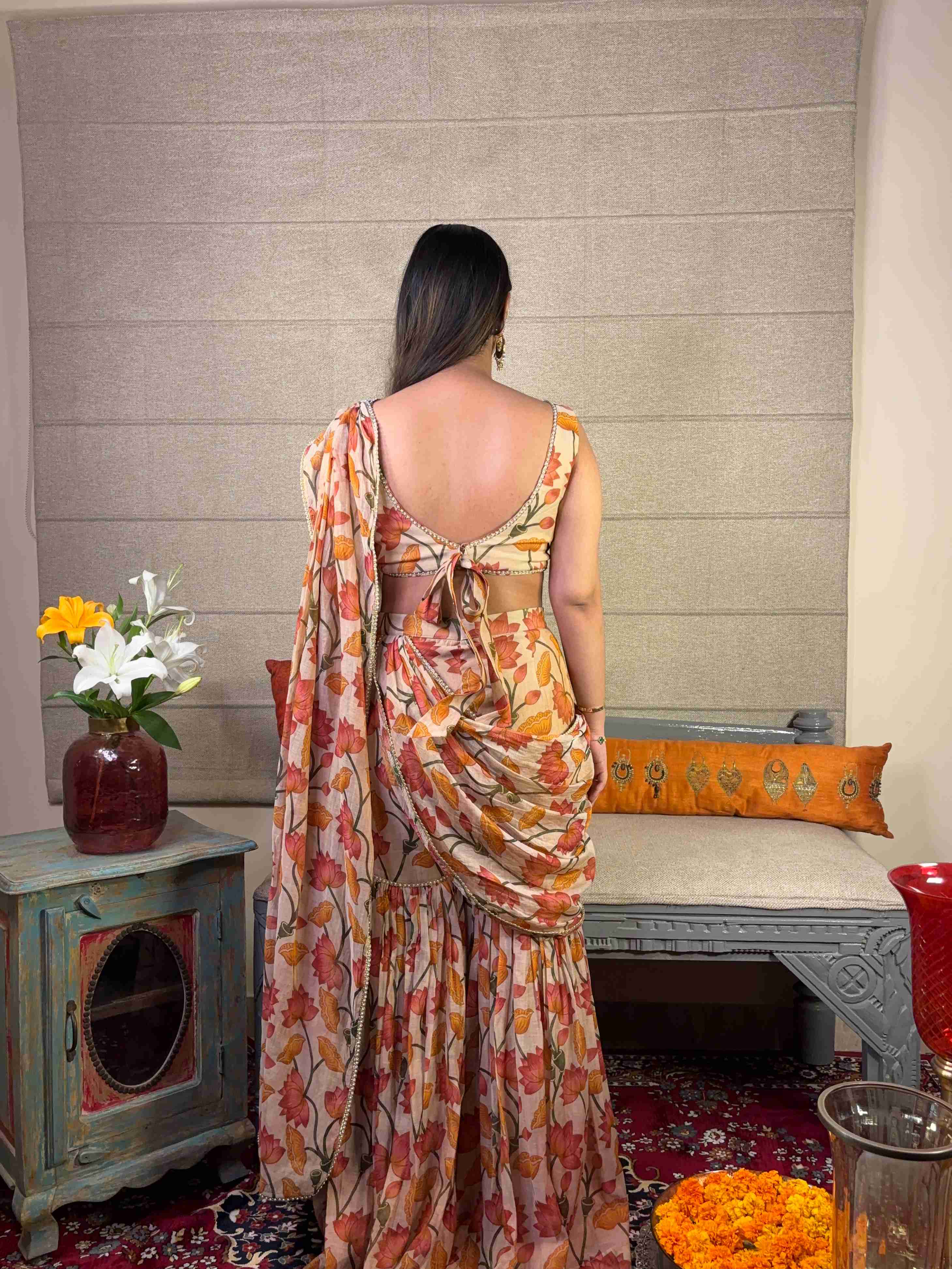A model showcasing Floral Print Ivory Draped Saree Set by Miithhii Elaychii from Miithhii Elaychii's collection