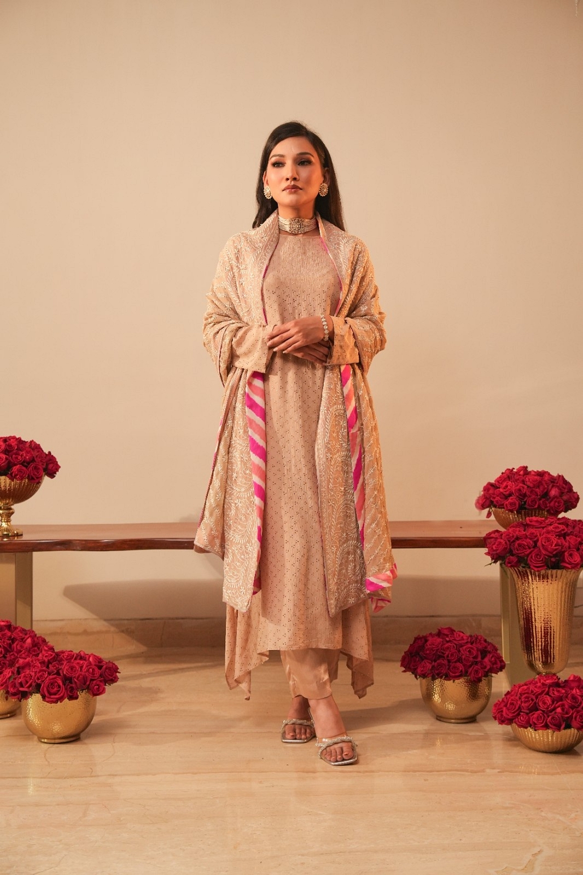 A model showcasing Beige Mukaish Kurta With Heavy Chikan Dupatta Feature image by Myra By Anju Narian from Myra By Anju Narian's collection