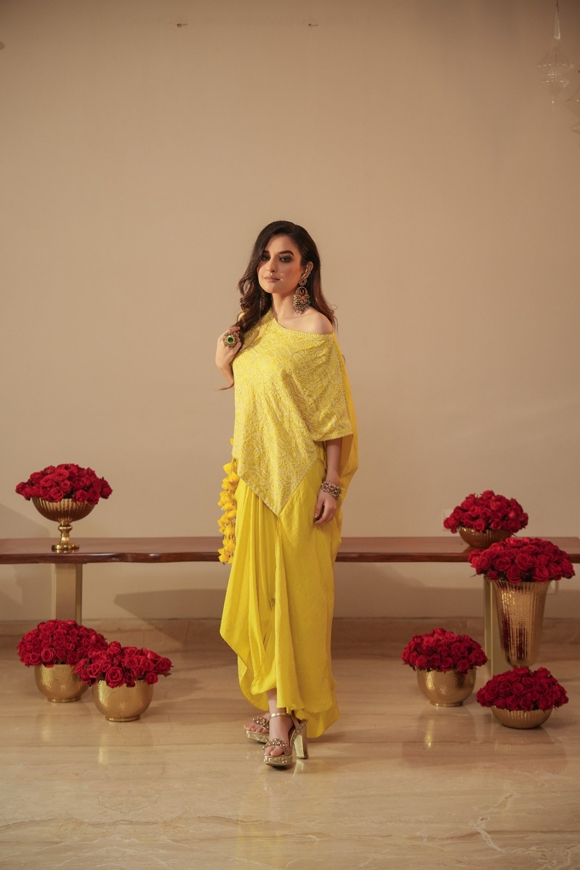 A model showcasing Chikankari Asymmetrical Tunic With Tassels And Dhoti Feature image by Myra By Anju Narian from Myra By Anju Narian's collection