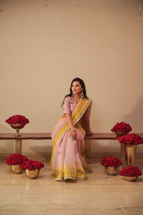 A model showcasing Lilac And Olive Shaded Organza Saree With Zardosi Blouse by Myra By Anju Narian from Myra By Anju Narian's collection A model showcasing Lilac And Olive Shaded Organza Saree With Zardosi Blouse by Myra By Anju Narian from Myra By Anju Narian's collection