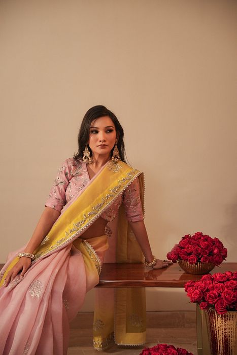 A model showcasing Lilac And Olive Shaded Organza Saree With Zardosi Blouse by Myra By Anju Narian from Myra By Anju Narian's collection A model showcasing Lilac And Olive Shaded Organza Saree With Zardosi Blouse by Myra By Anju Narian from Myra By Anju Narian's collection