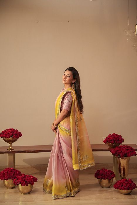 A model showcasing Lilac And Olive Shaded Organza Saree With Zardosi Blouse by Myra By Anju Narian from Myra By Anju Narian's collection A model showcasing Lilac And Olive Shaded Organza Saree With Zardosi Blouse by Myra By Anju Narian from Myra By Anju Narian's collection