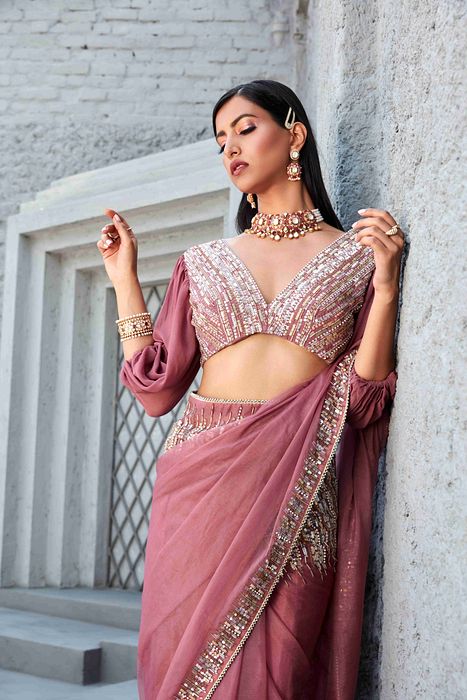 A model showcasing Oraganza Saree With Reglan Puff Sleeve Blouse by Ranian from Ranian's collection A model showcasing Oraganza Saree With Reglan Puff Sleeve Blouse by Ranian from Ranian's collection
