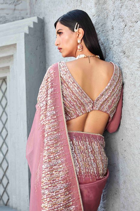 A model showcasing Oraganza Saree With Reglan Puff Sleeve Blouse by Ranian from Ranian's collection A model showcasing Oraganza Saree With Reglan Puff Sleeve Blouse by Ranian from Ranian's collection