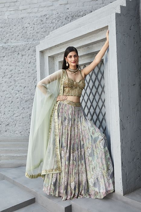A model showcasing Lilian Print 2 Tier Lengha Corset Set by Ranian from Ranian's collection