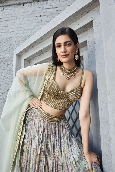 A model showcasing Lilian Print 2 Tier Lengha Corset Set by Ranian from Ranian's collection