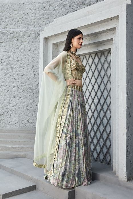 A model showcasing Lilian Print 2 Tier Lengha Corset Set by Ranian from Ranian's collection