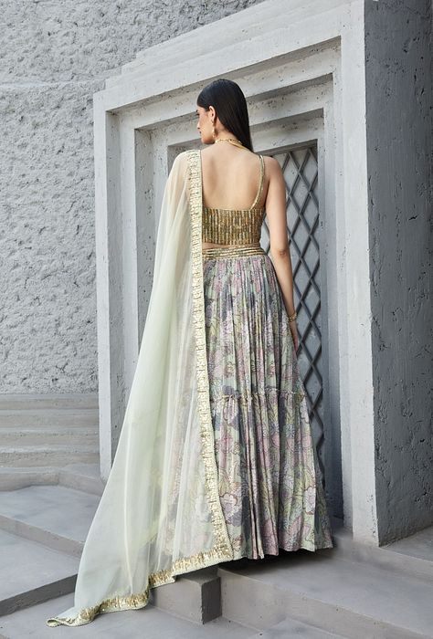 A model showcasing Lilian Print 2 Tier Lengha Corset Set by Ranian from Ranian's collection