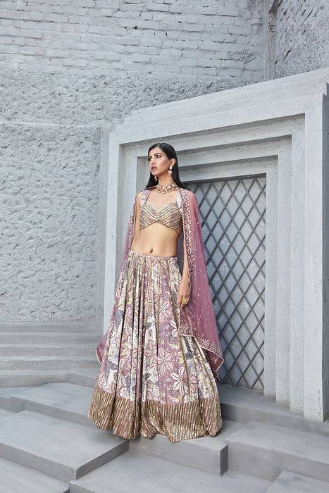 A model showcasing Rose Pink Lilian Print Lengha by Ranian from Ranian's collection A model showcasing Rose Pink Lilian Print Lengha by Ranian from Ranian's collection