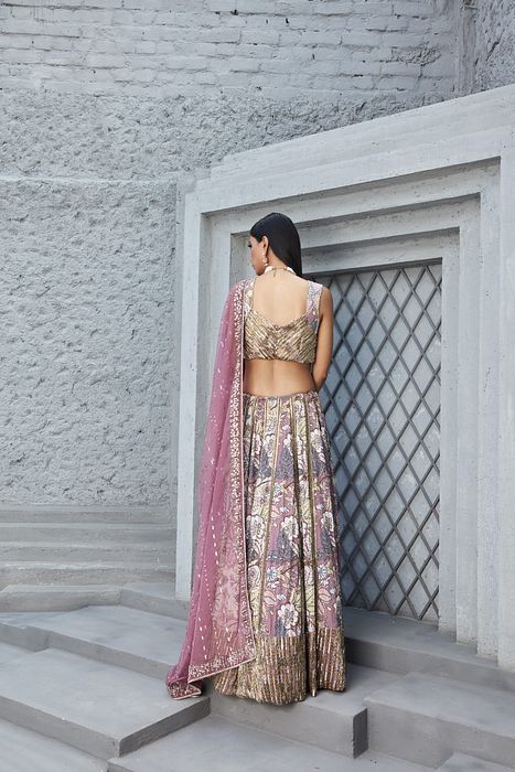 A model showcasing Rose Pink Lilian Print Lengha by Ranian from Ranian's collection A model showcasing Rose Pink Lilian Print Lengha by Ranian from Ranian's collection
